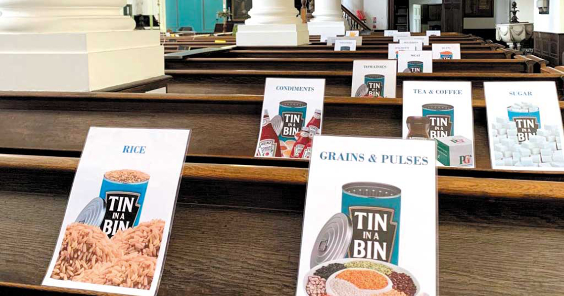 Tin in a Bin signs on church benches