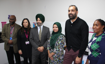 Leader, Deputy Leader and Council staff in a kitchen