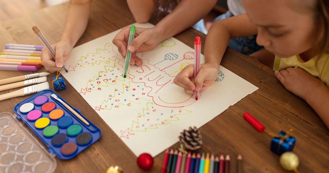 children drawing a Christmas card