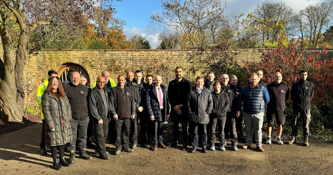 Cllr Rai standing with parks officers in Valentines Park